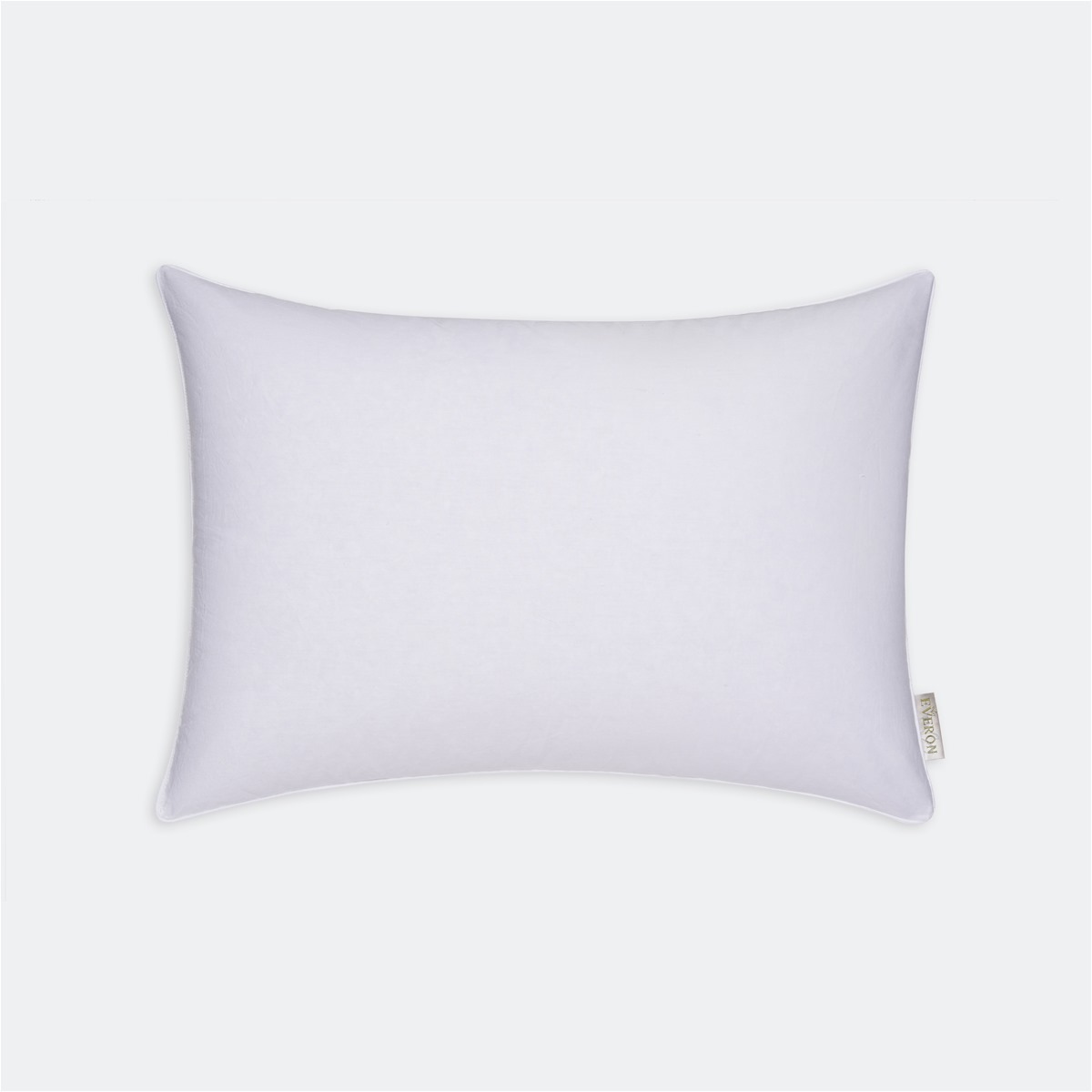 A white pillow on a white backgroundAI-generated content may be incorrect.